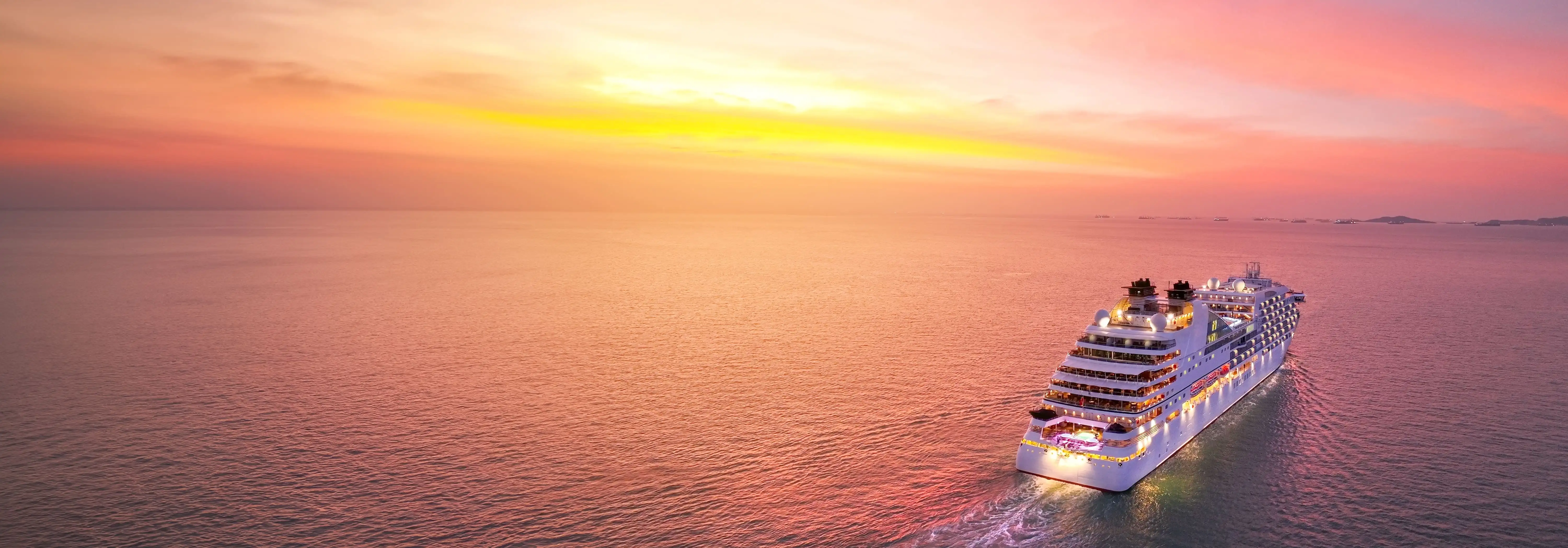 Luxury ocean cruise ship at sunset